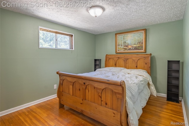 36426 Weideman St, Clinton Township, MI 48035 - bedroom with wood finished floors and a textured ceiling