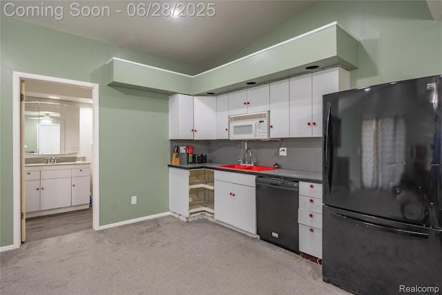 36426 Weideman St, Clinton Township, MI 48035 - kitchen featuring black appliances, white cabinetry, light colored carpet, lofted ceiling, and dark countertops