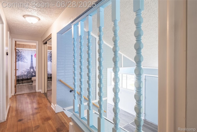 36426 Weideman St, Clinton Township, MI 48035 - corridor with a textured ceiling and hardwood / wood-style floors