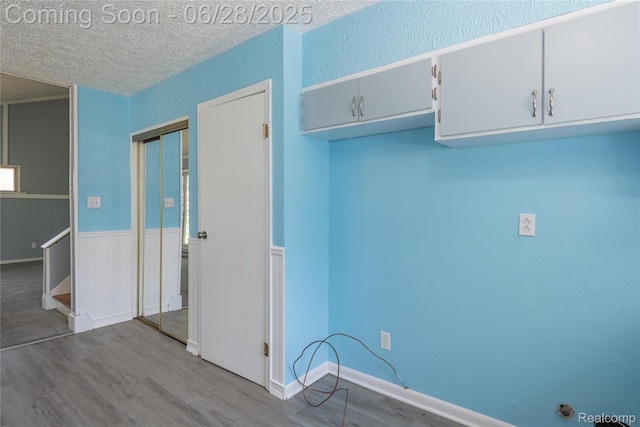 36426 Weideman St, Clinton Township, MI 48035 - kitchen with wood finished floors, a textured ceiling, and wainscoting