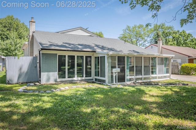 36426 Weideman St, Clinton Township, MI 48035 - rear view of property featuring a sunroom, brick siding, a chimney, and a shingled roof