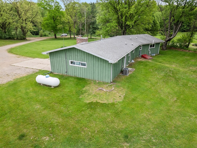 7060 Dobson Rd, Jonesville, MI 49250 - view of outbuilding featuring central AC unit and driveway