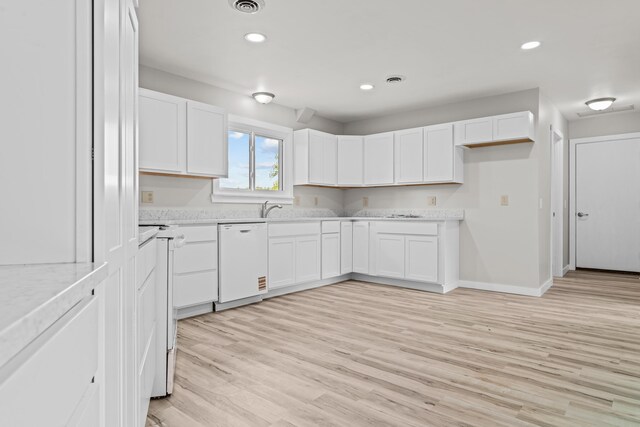 7060 Dobson Rd, Jonesville, MI 49250 - kitchen featuring dishwasher, light countertops, white cabinetry, light wood-style floors, and recessed lighting