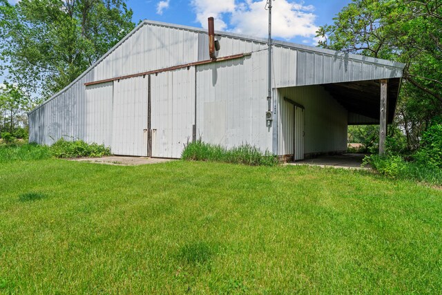 7060 Dobson Rd, Jonesville, MI 49250 - view of pole building with a lawn