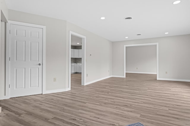 7060 Dobson Rd, Jonesville, MI 49250 - spare room featuring light wood-style floors, recessed lighting, and baseboards