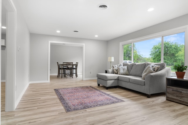 7060 Dobson Rd, Jonesville, MI 49250 - living room featuring light wood-style floors, baseboards, and recessed lighting