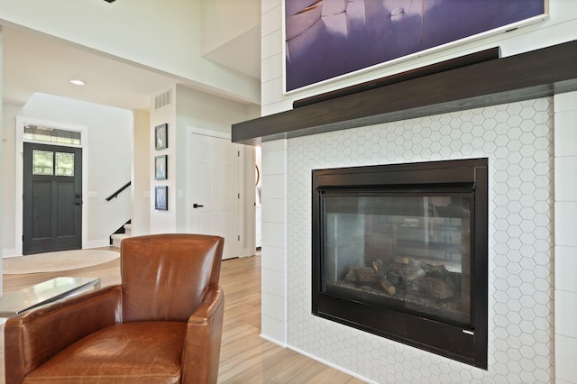 8460 Woodridge Dr, Davison, MI 48423 - detailed view of wood finished floors, a tile fireplace, and recessed lighting