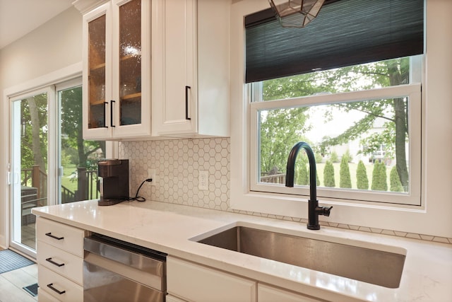 8460 Woodridge Dr, Davison, MI 48423 - kitchen with dishwasher, tasteful backsplash, light stone countertops, and glass insert cabinets