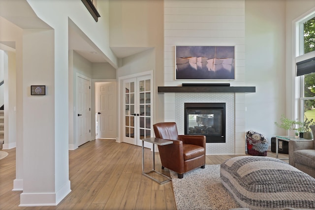 8460 Woodridge Dr, Davison, MI 48423 - living area featuring stairway, wood finished floors, french doors, and healthy amount of natural light