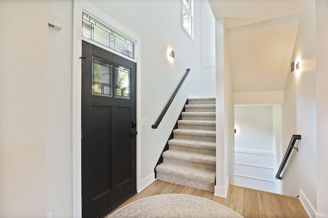 8460 Woodridge Dr, Davison, MI 48423 - entryway featuring healthy amount of natural light, wood finished floors, stairway, and a towering ceiling