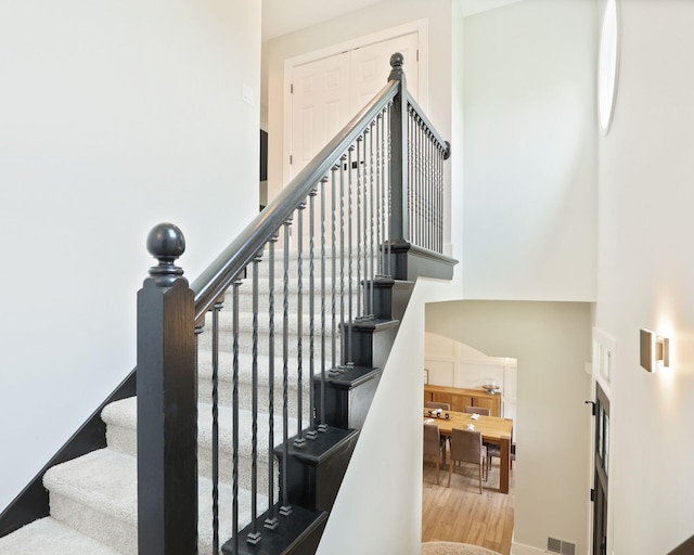 8460 Woodridge Dr, Davison, MI 48423 - stairs with a high ceiling and wood finished floors