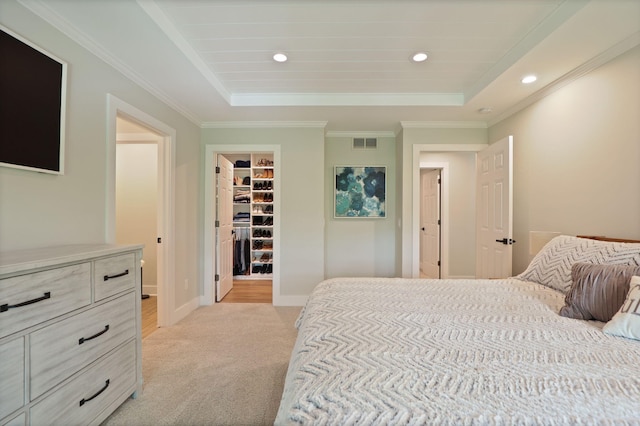 8460 Woodridge Dr, Davison, MI 48423 - bedroom with light carpet, a walk in closet, a tray ceiling, recessed lighting, and crown molding