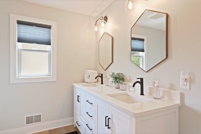 8460 Woodridge Dr, Davison, MI 48423 - bathroom with double vanity and wood finished floors