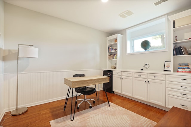 8460 Woodridge Dr, Davison, MI 48423 - office area with wainscoting and light wood-style flooring