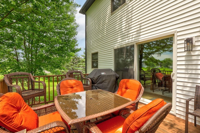 8460 Woodridge Dr, Davison, MI 48423 - deck with a grill and outdoor dining space
