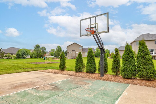 8460 Woodridge Dr, Davison, MI 48423 - view of sport court featuring basketball court, a playground, and a lawn
