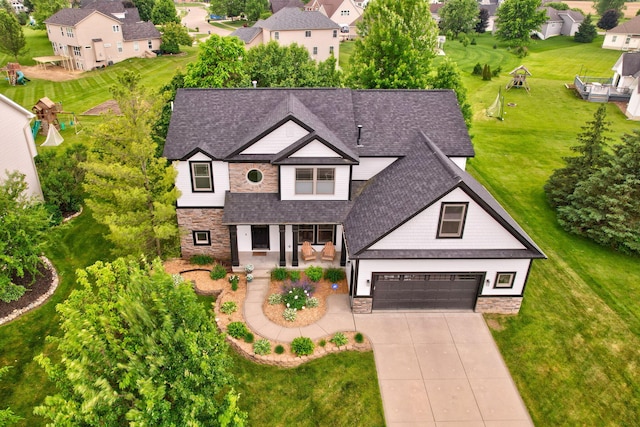 8460 Woodridge Dr, Davison, MI 48423 - view of front of house with stone siding, roof with shingles, driveway, and a garage