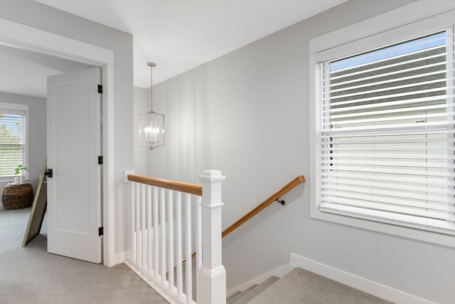 245 Cavelier Ave, Saint Joseph, MI 49085 - stairway featuring a chandelier, carpet flooring, and baseboards