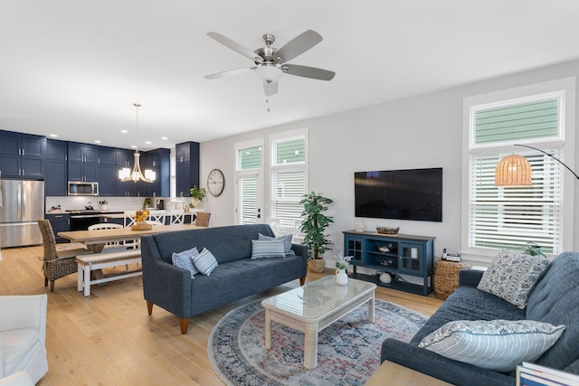 245 Cavelier Ave, Saint Joseph, MI 49085 - living area featuring plenty of natural light, a chandelier, a ceiling fan, light wood-type flooring, and recessed lighting