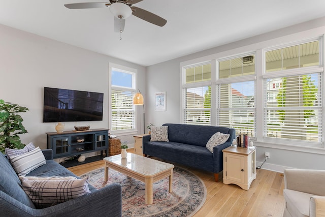 245 Cavelier Ave, Saint Joseph, MI 49085 - living room with ceiling fan, baseboards, and light wood finished floors