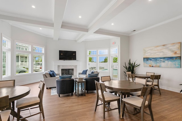 245 Cavelier Ave, Saint Joseph, MI 49085 - dining room featuring a high end fireplace, beam ceiling, light wood-style floors, ornamental molding, and recessed lighting