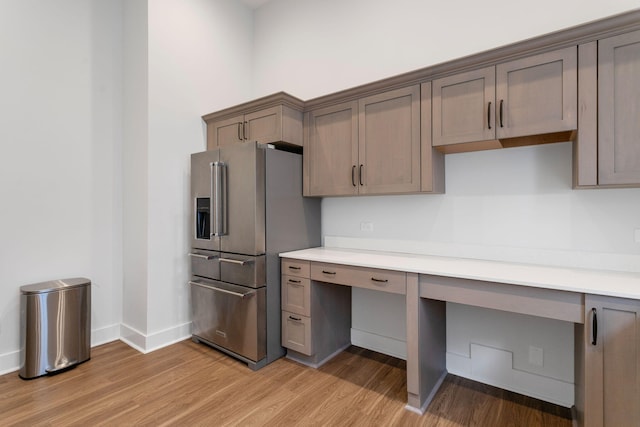 245 Cavelier Ave, Saint Joseph, MI 49085 - kitchen with high quality fridge, light wood finished floors, light countertops, and baseboards