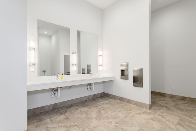 245 Cavelier Ave, Saint Joseph, MI 49085 - bathroom with baseboards, double vanity, and marble finish floors
