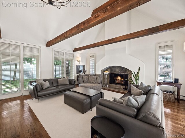 822 Suffield Ave, Birmingham, MI 48009 - living room with a warm lit fireplace, beamed ceiling, dark wood-type flooring, high vaulted ceiling, and a chandelier