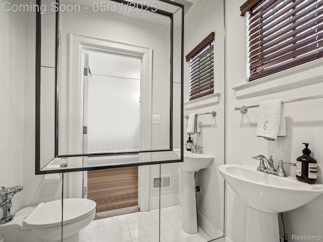 822 Suffield Ave, Birmingham, MI 48009 - half bathroom featuring tile patterned floors, toilet, and baseboards