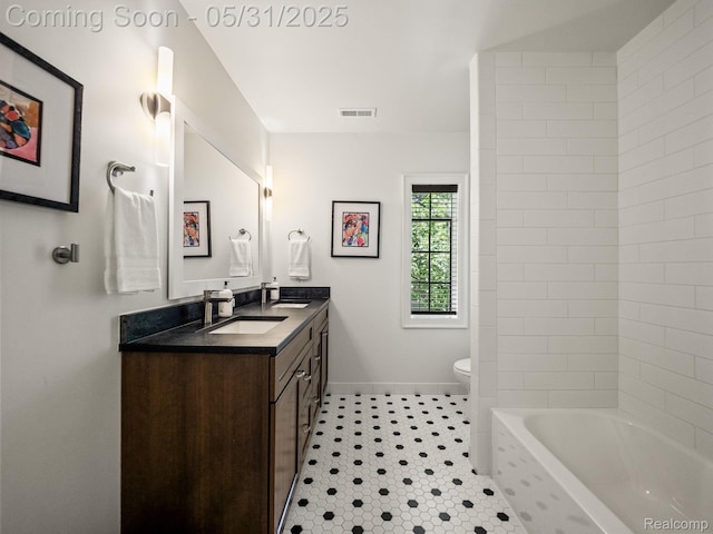 822 Suffield Ave, Birmingham, MI 48009 - full bath featuring double vanity, toilet, baseboards, tile patterned flooring, and washtub / shower combination