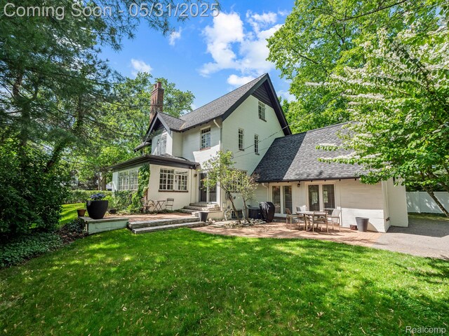 822 Suffield Ave, Birmingham, MI 48009 - rear view of property with a chimney, french doors, a lawn, roof with shingles, and a patio area