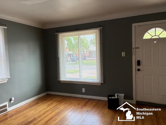13535 Netherwood St, Southgate, MI 48195 - foyer with healthy amount of natural light, wood finished floors, and baseboards