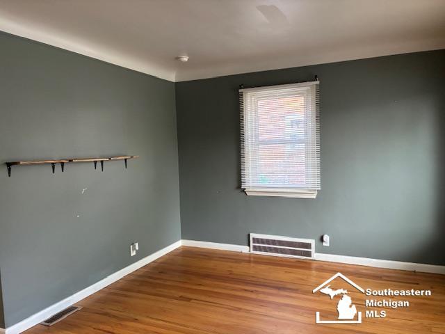 13535 Netherwood St, Southgate, MI 48195 - unfurnished room featuring wood finished floors and baseboards