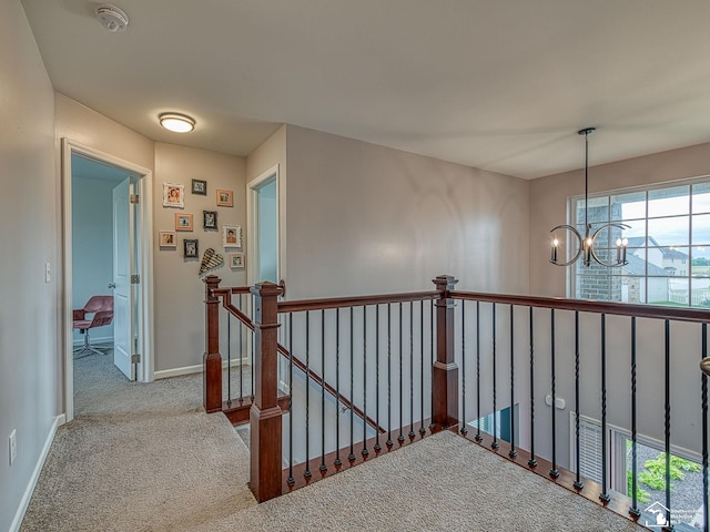 691 Foxworth St, Dundee, MI 48131 - hallway featuring an upstairs landing, carpet, a chandelier, and baseboards