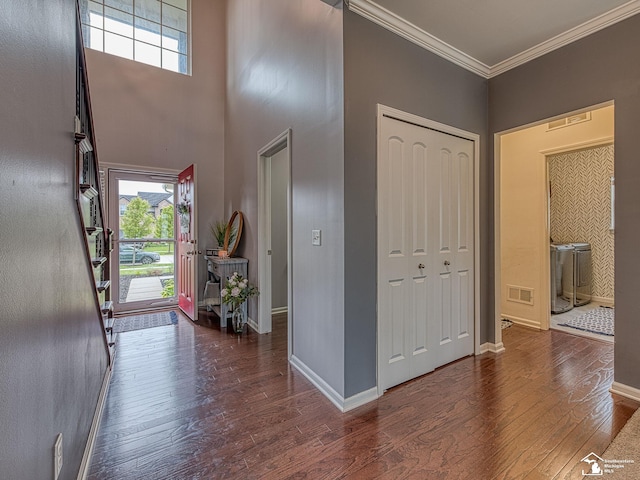 691 Foxworth St, Dundee, MI 48131 - foyer entrance with hardwood / wood-style flooring, plenty of natural light, crown molding, baseboards, and a towering ceiling