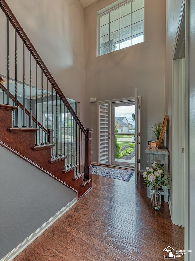 691 Foxworth St, Dundee, MI 48131 - entryway with a towering ceiling, wood finished floors, healthy amount of natural light, and stairs