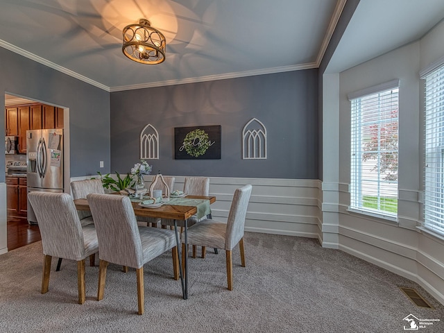 691 Foxworth St, Dundee, MI 48131 - dining room featuring carpet floors, wainscoting, ornamental molding, and a chandelier