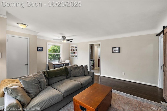 2111 Ellwood Ave, Berkley, MI 48072 - living area featuring dark wood-style floors, a barn door, and ceiling fan