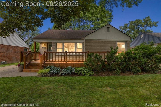 2111 Ellwood Ave, Berkley, MI 48072 - view of front of property with a front yard, brick siding, and a deck
