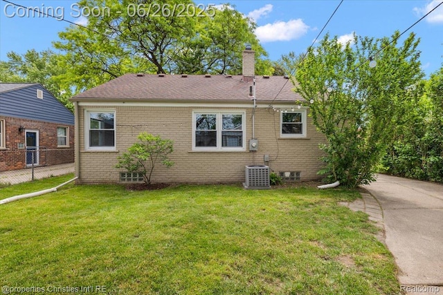2111 Ellwood Ave, Berkley, MI 48072 - rear view of property featuring a chimney, brick siding, and roof with shingles