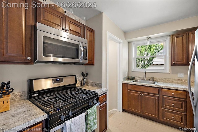 2111 Ellwood Ave, Berkley, MI 48072 - kitchen with appliances with stainless steel finishes and light countertops