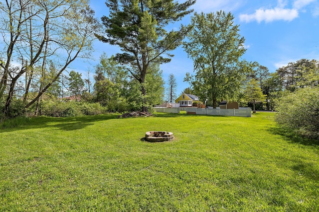17270 Taft Rd, Spring Lake, MI 49456 - view of yard featuring an outdoor fire pit