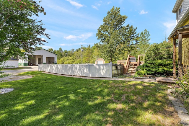17270 Taft Rd, Spring Lake, MI 49456 - view of yard with an outdoor structure, stairs, and a deck