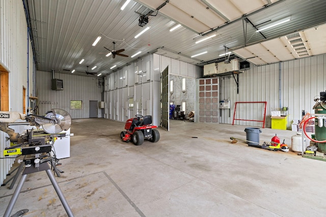 17270 Taft Rd, Spring Lake, MI 49456 - garage featuring a ceiling fan and metal wall