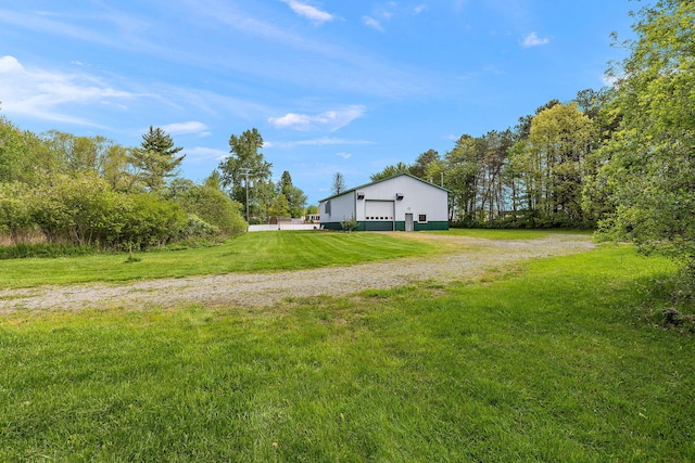 17270 Taft Rd, Spring Lake, MI 49456 - view of grassy yard with a detached garage and an outbuilding