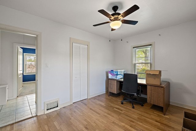 17270 Taft Rd, Spring Lake, MI 49456 - office area with hardwood / wood-style floors, healthy amount of natural light, baseboards, and a ceiling fan