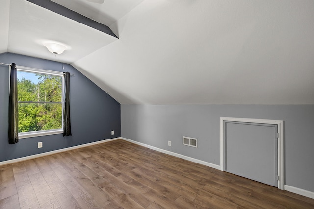17270 Taft Rd, Spring Lake, MI 49456 - bonus room with lofted ceiling, wood finished floors, and baseboards