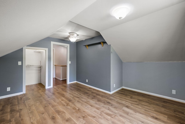 17270 Taft Rd, Spring Lake, MI 49456 - bonus room featuring lofted ceiling, a ceiling fan, wood finished floors, and baseboards