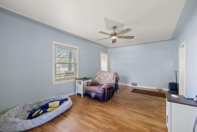 17270 Taft Rd, Spring Lake, MI 49456 - sitting room with ceiling fan, light wood-style floors, and baseboards