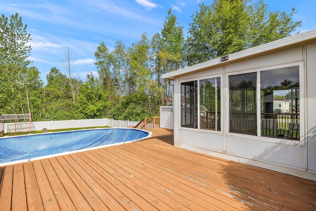 17270 Taft Rd, Spring Lake, MI 49456 - view of swimming pool with a wooden deck and a fenced backyard
